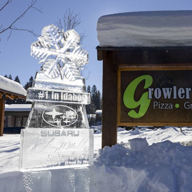 An ice sculpture with brand logos etched into the ice.