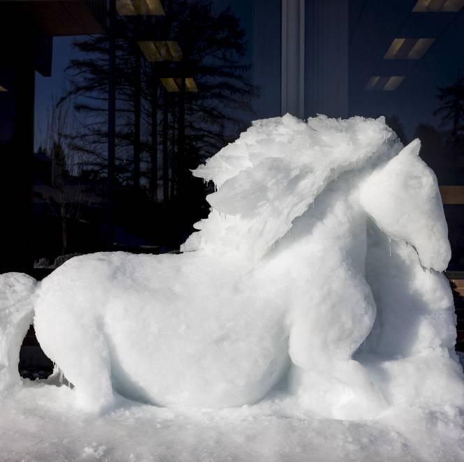 A horse sculpted out of ice and snow.