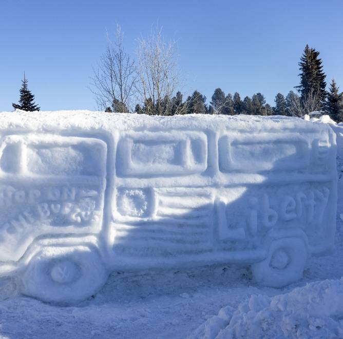 A patriotic bus sculpted out of ice and snow.