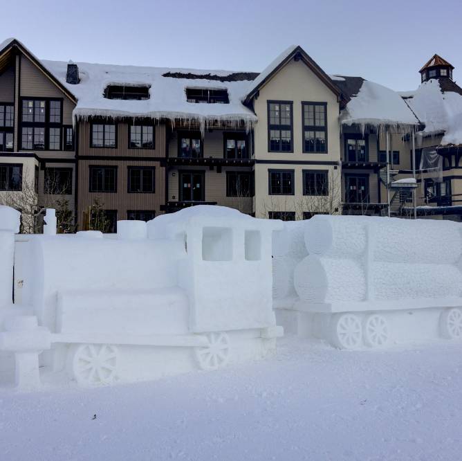 A train sculpted out of ice and snow.