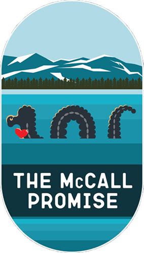 The McCall Promise badge featuring an illustration of Sharlie the sea serpent in water with trees and mountains in the background